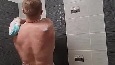 Muscular guy with big dick showering, jerking off and eating cum