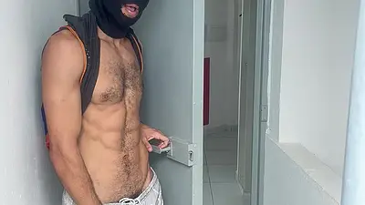 A guy with a big, flaccid penis showing off on the shopping mall stairs.