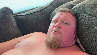 Chubby Guy Laying in Bed